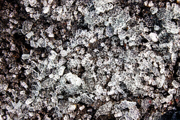 Many small fragments of broken glass. Broken glass texture.