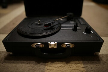 Retro vinyl record player. Vintage Gramophone. Black vinyl player.
