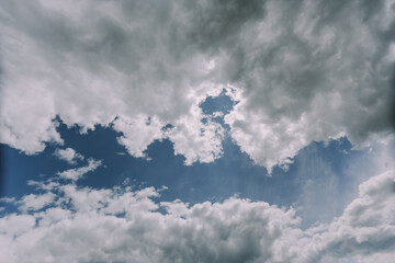 Fototapeta na wymiar white fluffy clouds with their silver lining . High quality photo