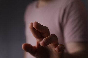 Obraz premium A man hand touching virtual screen, modern background concept , can put your text at the finger, copy space.