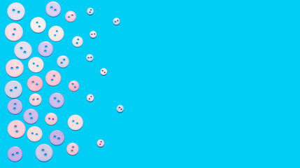 The banner is decorative. Blue background with colored sewing buttons in the form of a frame. The view from the top. Copy space for text