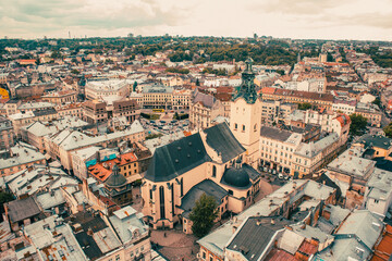 Fototapeta na wymiar Aerial view ot the old town of Lviv. View to the ancient church with some old houses around. 