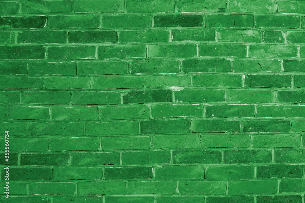 Wall mural green brick wall background inside of the room.