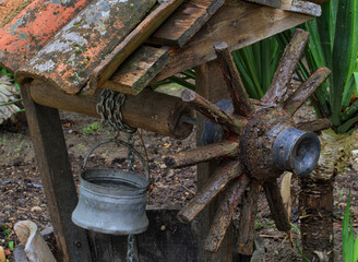 Old well in the yard of a country house.