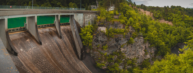 Small but steep dam for hydroelectric plant in Moste, Slovenia. View of the hidroelectric dam from above, looking down.