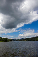 Landscape with clouds above Lipno lake, Czech Republic.