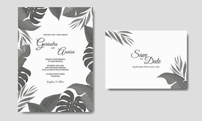   Wedding invitation card template set with dark tropical leaves decoration Premium Vector