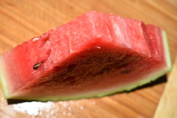 Sliced of watermelon isolated on wooden background.