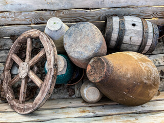 vintage jugs, cartwheels, and wooden barrels