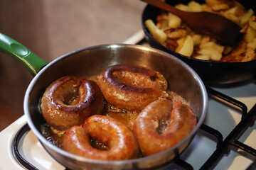 Frying sausages called 