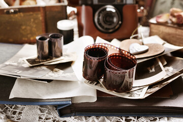 vintage style still life with old photographs and camera in sepia
