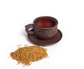 Helba seeds. Fenugreek on a white background. Healthy herb. Хельба. Фунгерек. Шамбала. Пажитник. Helba. Fungere. Fenugreek. 