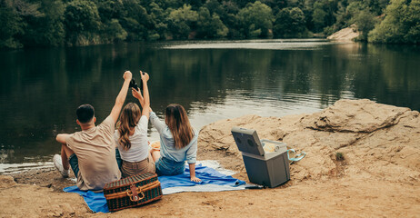 Young friends making a toast on a camping trip.