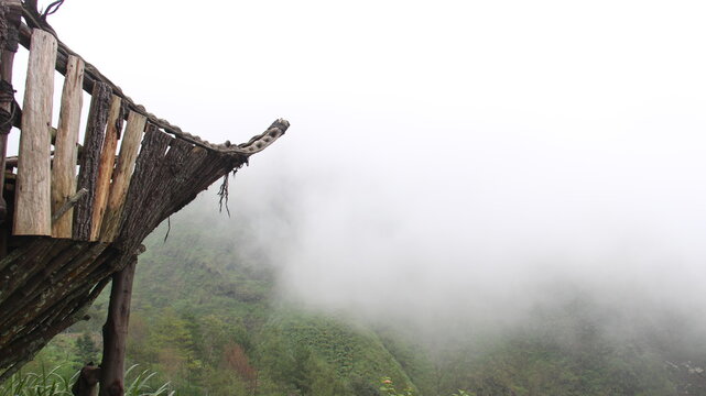 wooden boats located in the hills for tourist photos. wooden ship with a background in the peak of Mount Arjuno-Welirang, Indonesia