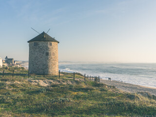 old windmill on the beach