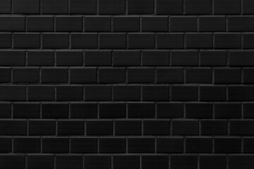 Black stone brick texture and background. Wall dark brick wall texture background.