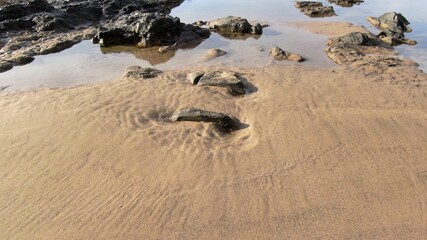 contemplate the sunset and the sea from the cliffs next to the Golden sand