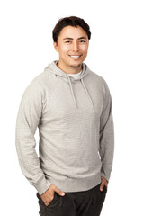 A cute Asian guy with jet black hair looking cool with his nice smile wearing a grey hoodie with both hands in his pocket.