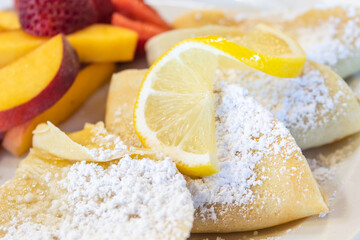 Lemon Bar Pastry with Sugar and Sliced Lemon and Peach Fruits