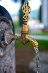 Historical fountain, antique Turkish faucet on wall