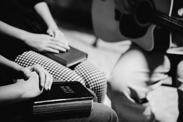 Black and white of group people praying worship believe.