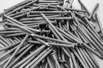 Steel nails for concrete Iron nails ,Close up Lots of iron nails texture background , Screw nut isolated 