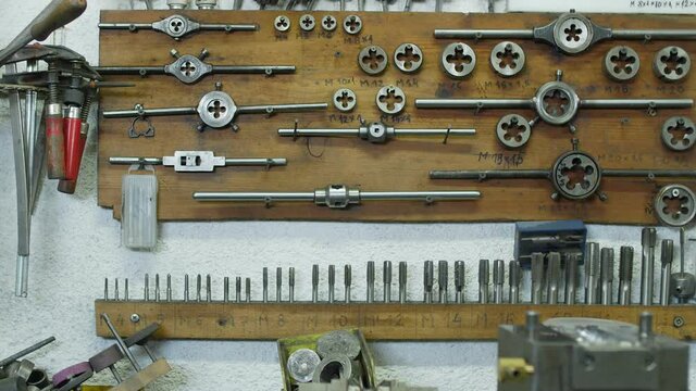 Work tools hanging on wall at workshop
