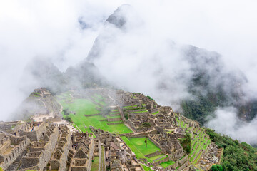 Fototapeta premium Machu Picchu, a Peruvian Historical Sanctuary and a UNESCO World Heritage Site. One of the New Seven Wonders of the World