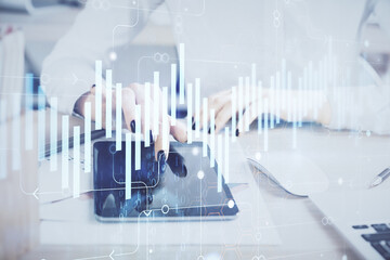 Double exposure of forex chart sketch hologram and woman holding and using a mobile device. Financial market concept.