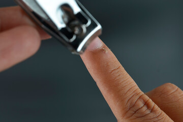 A nail clipper used to trim hangnails isolated on the black background.