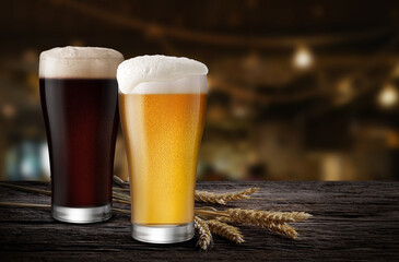 Glasses of Light Beer and Dark Beer with wheat on the bar counter in the restaurant at night, with copy space