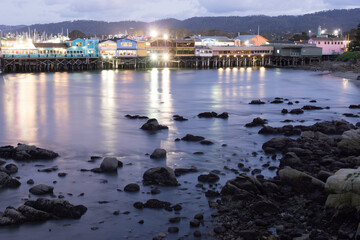 Fisherman's wharf in coastal scenic Monterey with long exposure at dusk