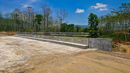 Fototapeta na wymiar Front view of a concrete bridge with steel beams
