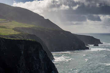 Moody rain and sun through the clouds near Bixby Bridge in coastal Big Sur, California