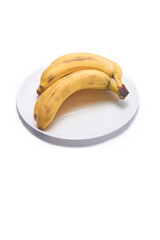 Bunch of bananas on a white background on a plate
