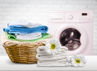 Laundry basket with colorful towels on desk