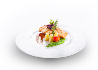 Fish fillet steak and salad and red lettuce on top, isolated on white.