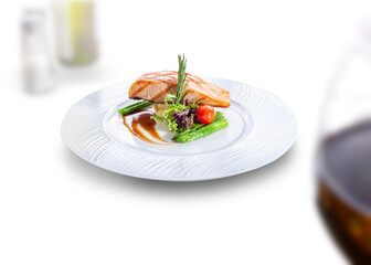 Salmon steak. Grilled salmon fillets and fresh fruit and vegetable salad, isolated white background.