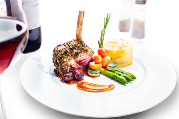 Smoked Ribs with sauteed vegetables, mashed potatoes. Dinner with wine, isolated on white.