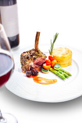 Grilled ribs steak with sauteed vegetables, mashed potatoes. Dinner with wine, isolated on white