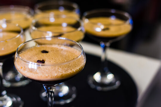 Espresso martini cocktails with coffee beans, close up, selective focus and copy space