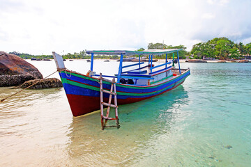 Fototapeta na wymiar Colorful boats and sandy beaches in Belitung, Indonesia.