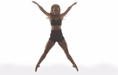 female sporty ballet dancer in front of white background