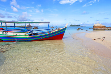 Colorful boats and sandy beaches in Belitung, Indonesia