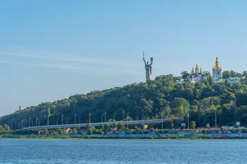 Fotobehang Motherland Monument viewed from Dnieper river in Kiev, Ukraine © dudlajzov