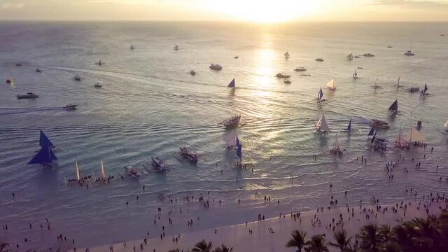 Boracay Coastline with Blue and White Sailing Boats on the Sea During Sunset, The Philippines, Southeast Asia.