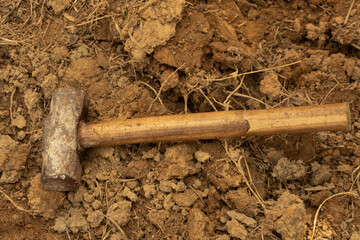 A hammer on the ground.