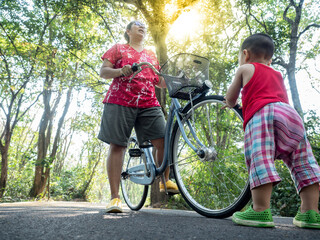 mother and child on holiday trip with bicycle