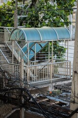 Stairs up to the bridge over the road in Thailand