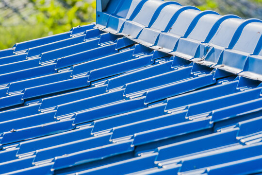 Blue metal corrugated roofing tiles.